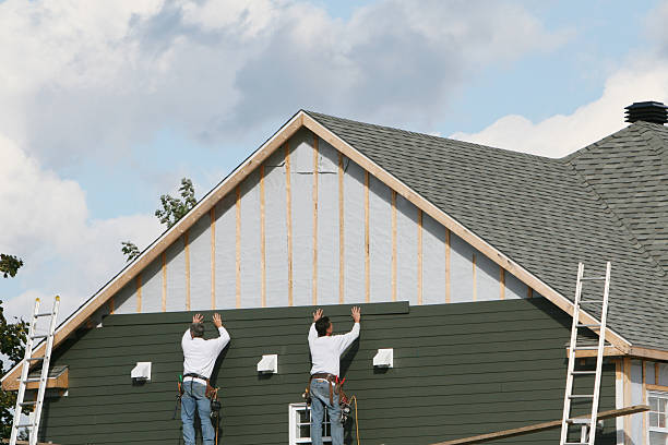 Professional Siding technician working in Greensboro, MD